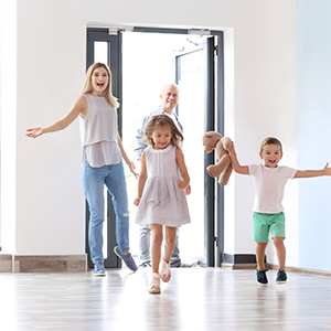 Family walking into new home. Relocating with your family
